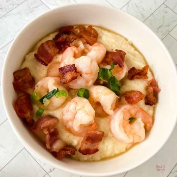 Top down view of shrimp and grits in a bowl.