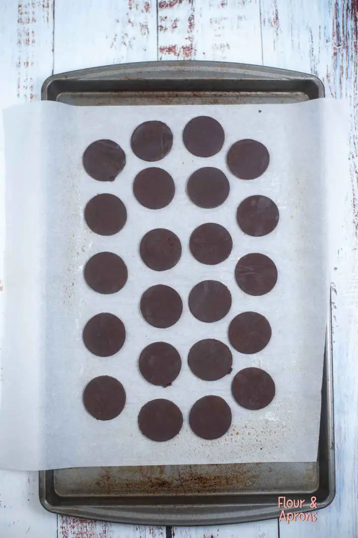 Circle cookies on a parchment lined cookie sheet.