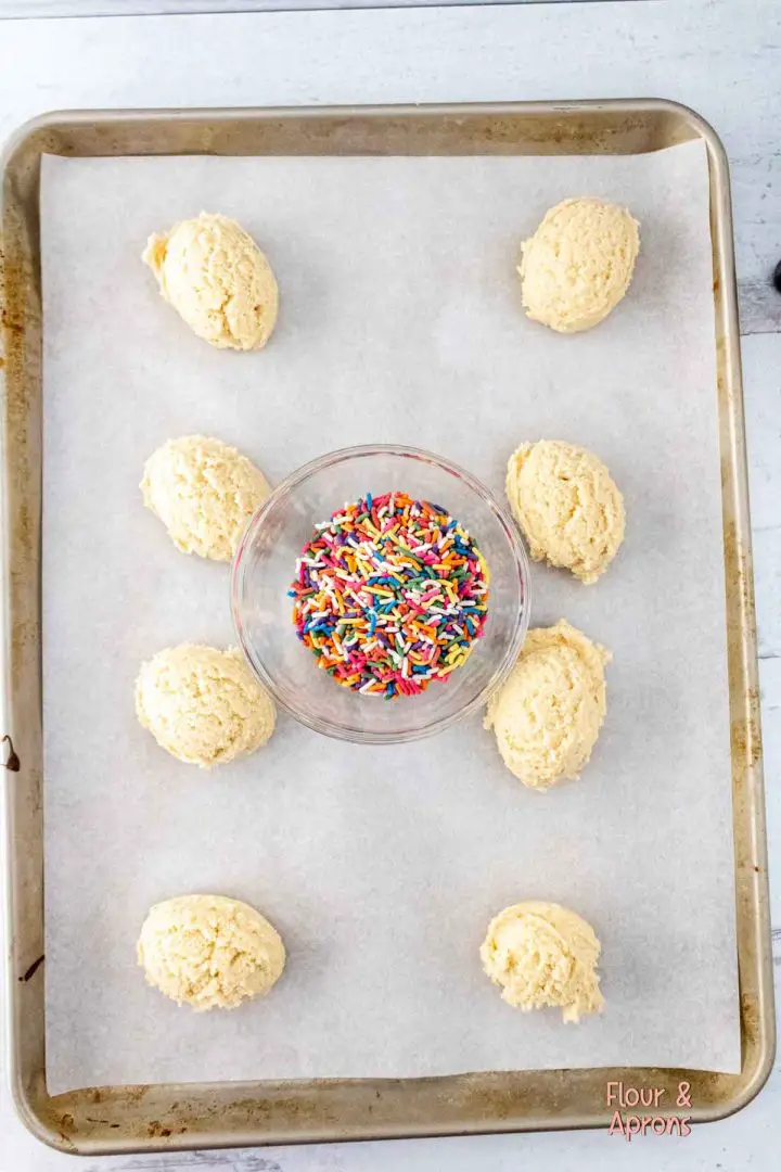 Balls of dough on baking sheet.