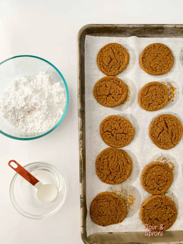 Cooled molasses cookies waiting to be frosted.