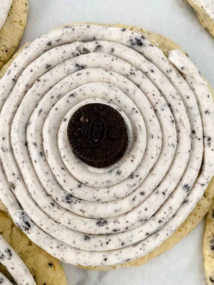 Spiral frosting added to cookie with mini Oreo on top.