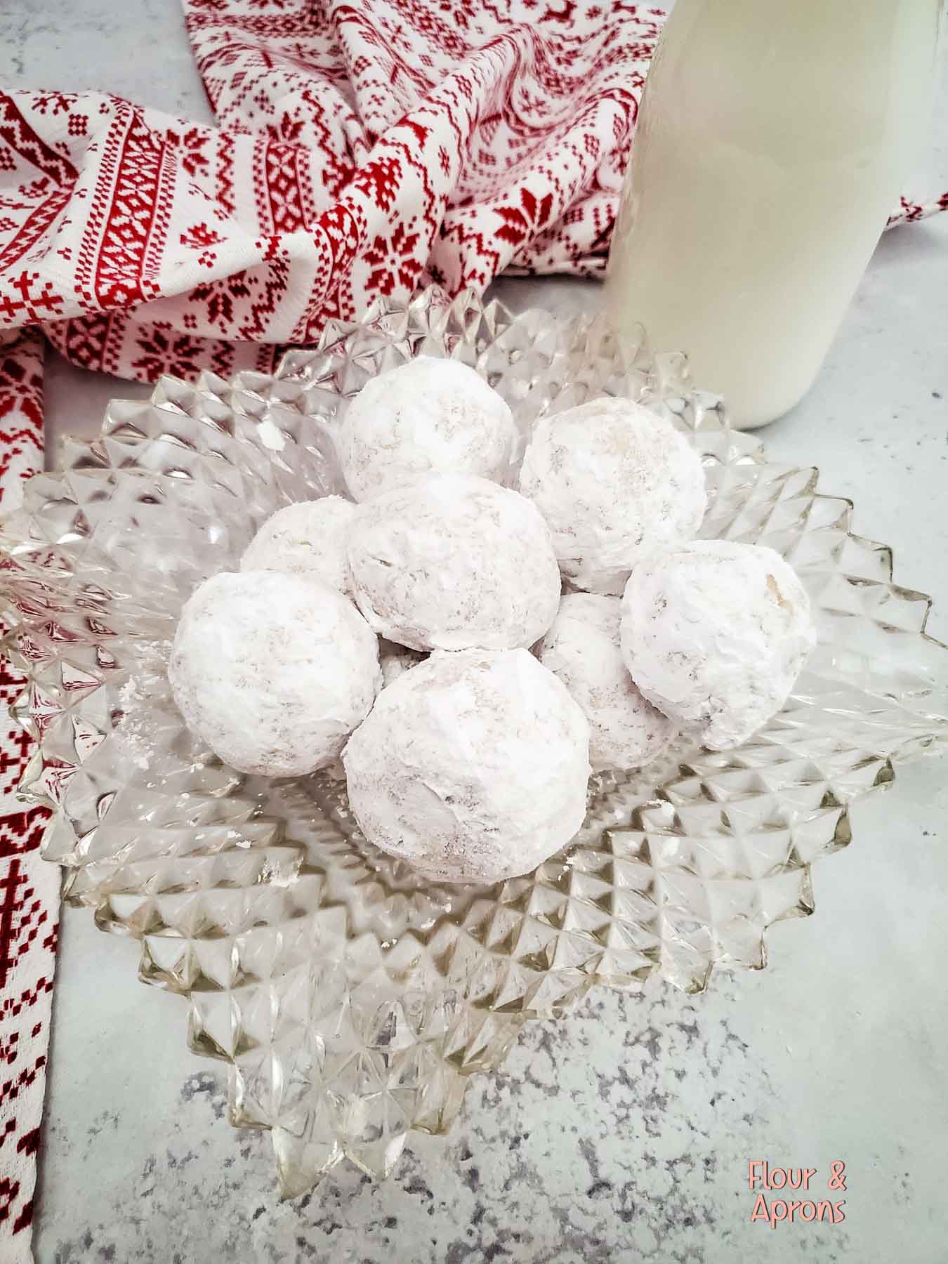 Snowball cookies on a plate.