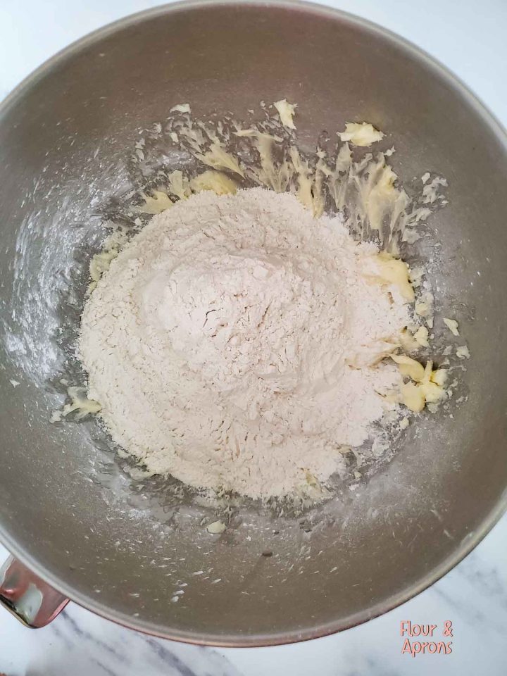 Flour on top of butter sugar mixture.