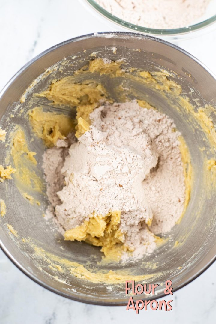 Dry ingredients on top of cookie dough.